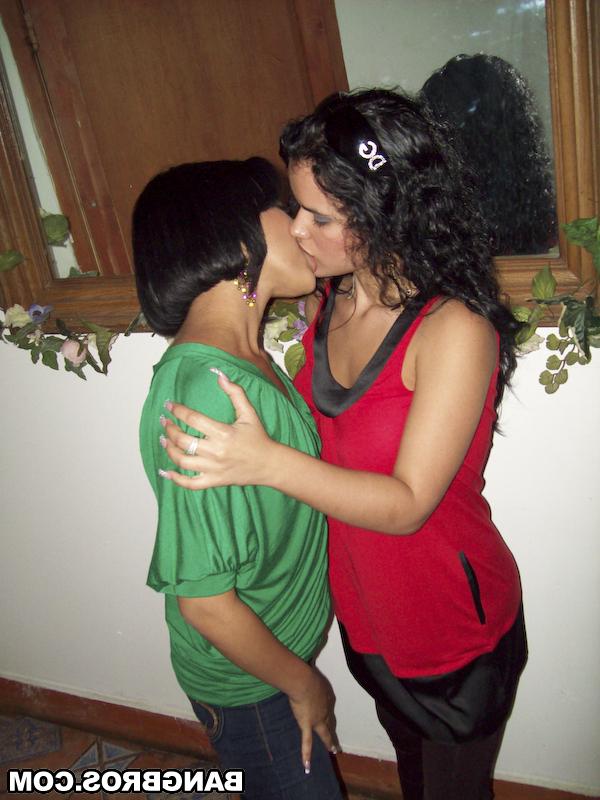20P Dark haired babes Anna and Carmen Lovss undress and play with a sex toy