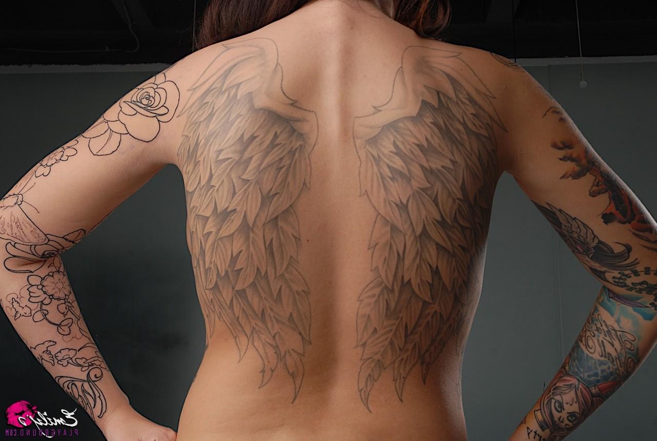 15P Solo model Emily Parker shows off her heavily tattooed body during closeups