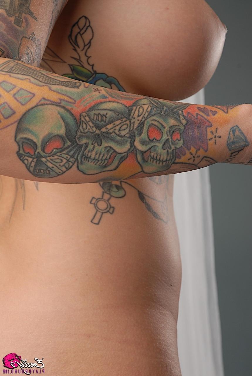 15P Solo model Emily Parker shows off her heavily tattooed body during closeups