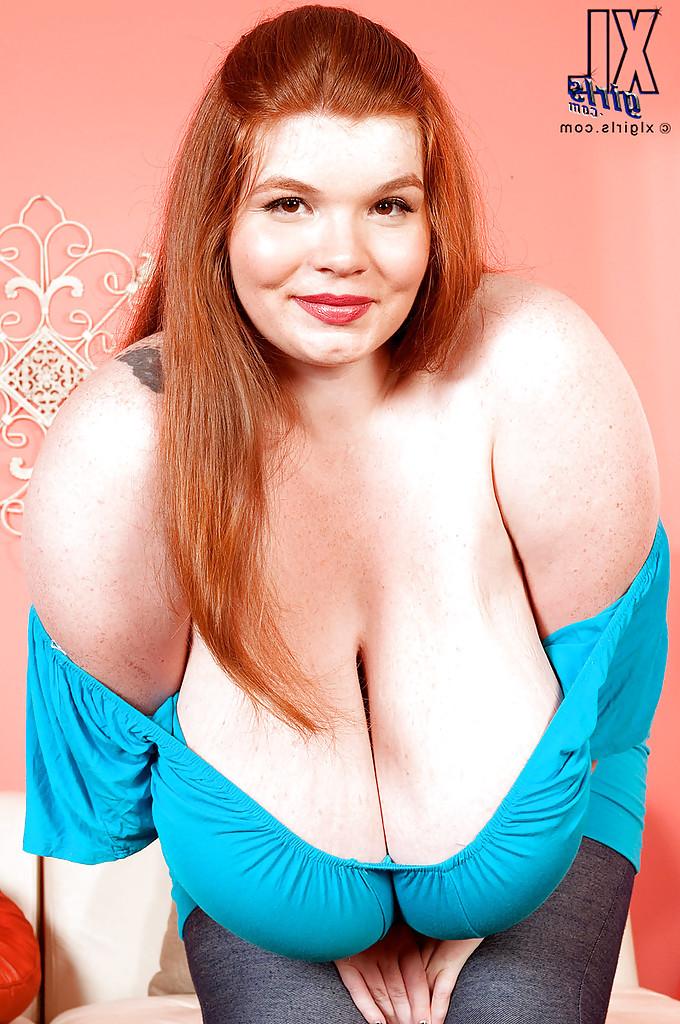 12P Redhead fatty babe Anorei Collins uncovering her giant flabby boobs