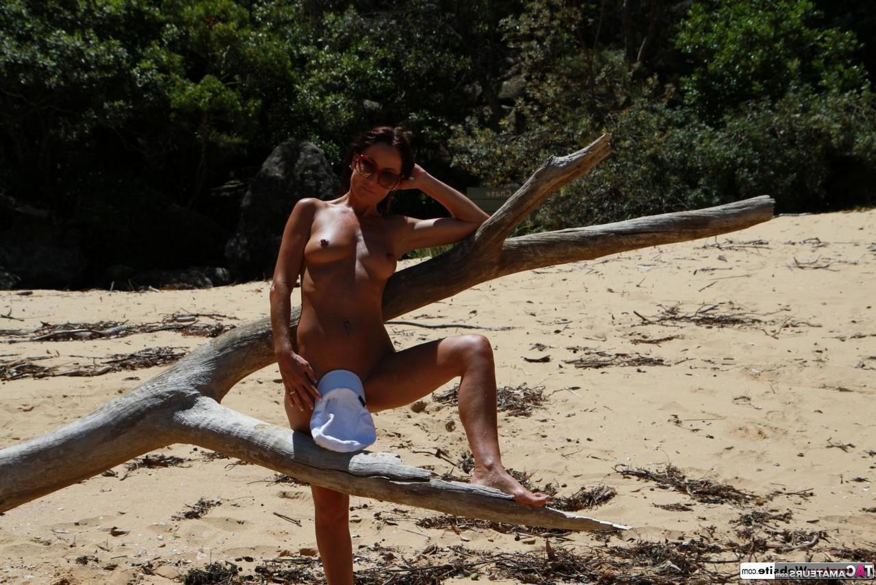16P Sexy MILF Roxeanne models in the nude at a nudist beach