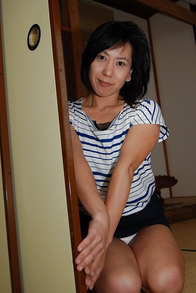 16P Astonishing Asian babe Masako undressing and showing her nipples