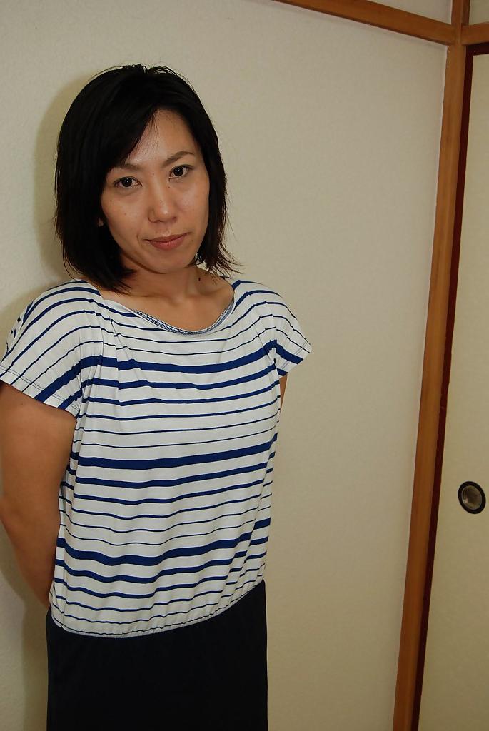 16P Astonishing Asian babe Masako undressing and showing her nipples