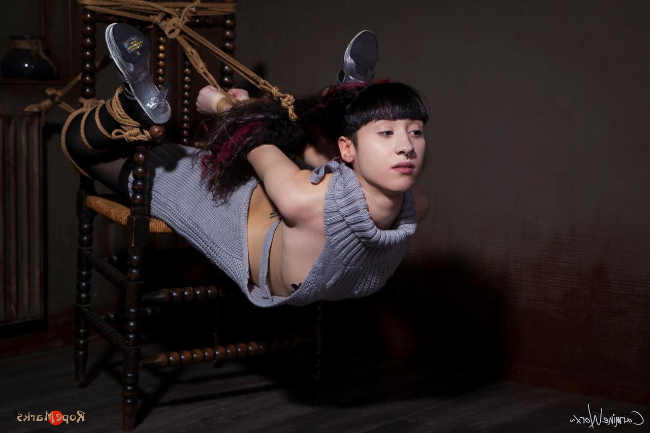 16P Solo girl Carmineworx is tied to a chair in a highly uncomfortable position