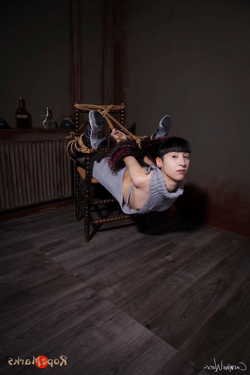 16P Solo girl Carmineworx is tied to a chair in a highly uncomfortable position