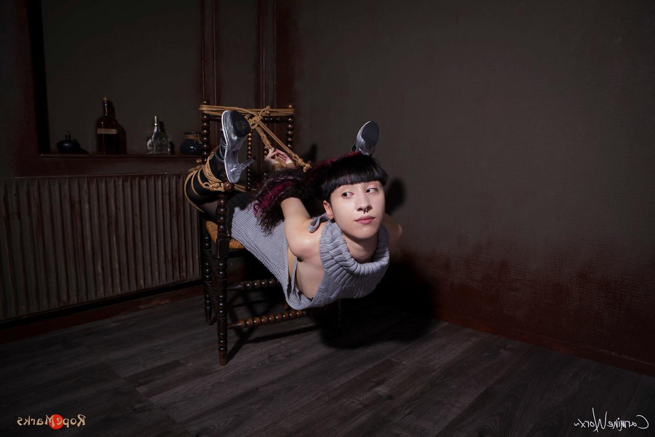 16P Solo girl Carmineworx is tied to a chair in a highly uncomfortable position