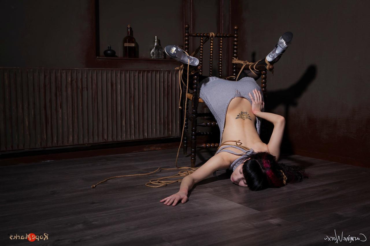 16P Solo girl Carmineworx is tied to a chair in a highly uncomfortable position