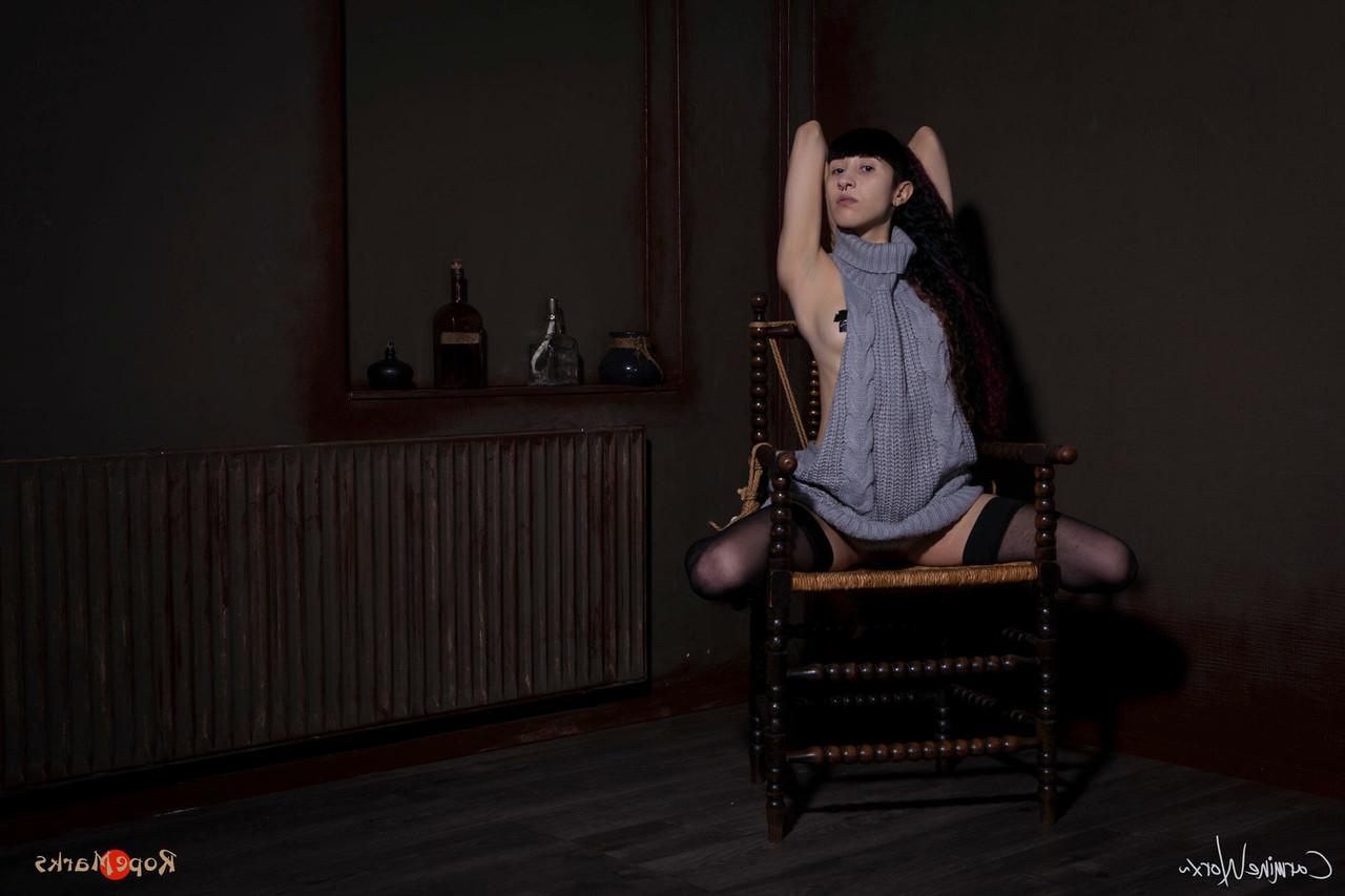 16P Solo girl Carmineworx is tied to a chair in a highly uncomfortable position