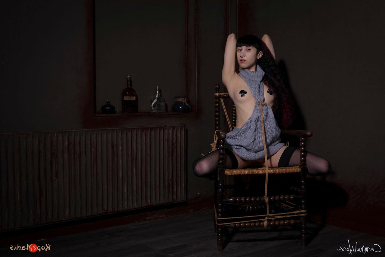 16P Solo girl Carmineworx is tied to a chair in a highly uncomfortable position