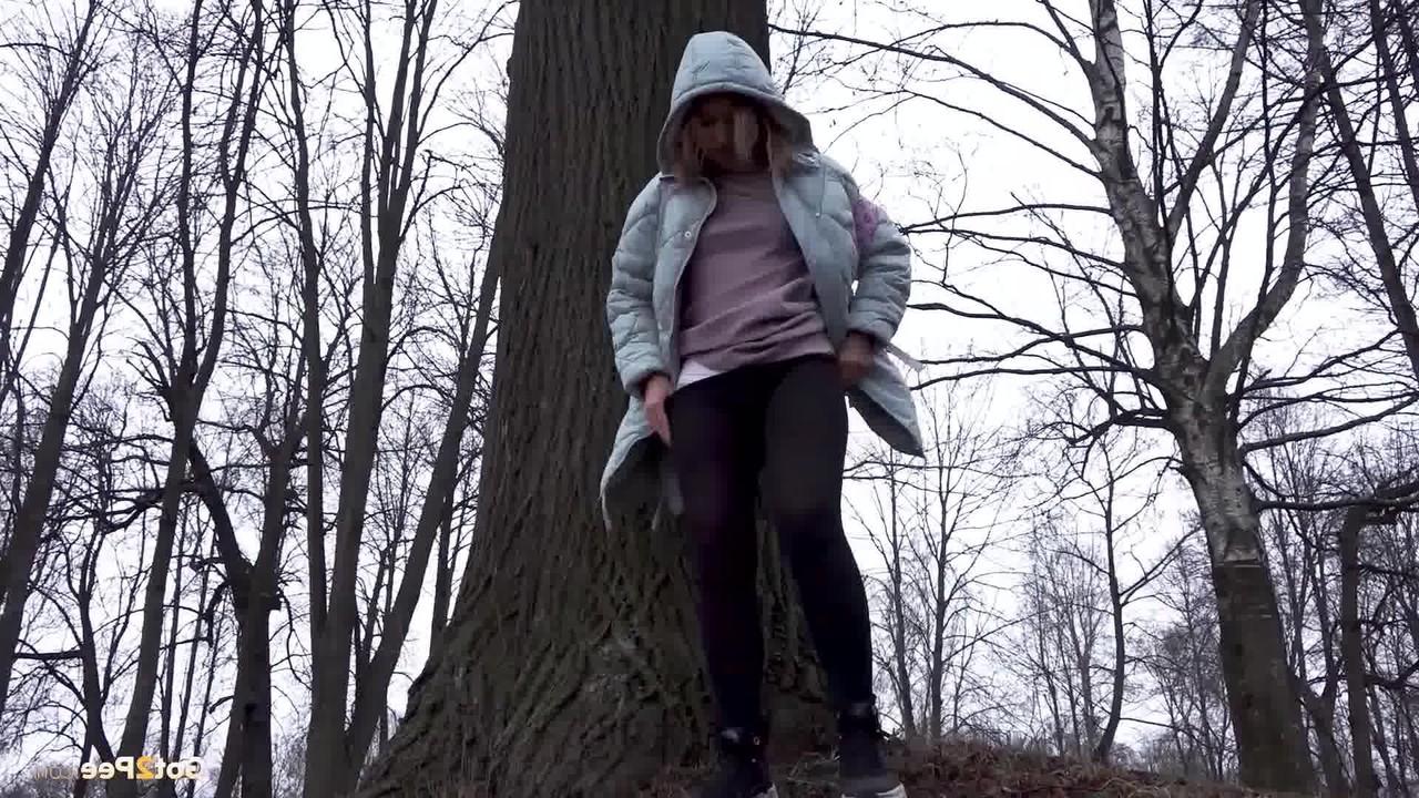 15P Distressed girl Rita pulls down her pantyhose to pee while walking in a forest