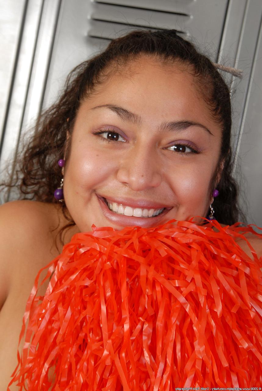 20P Petite curly haired cheerleader Reena shows her fat ass and hairy pussy