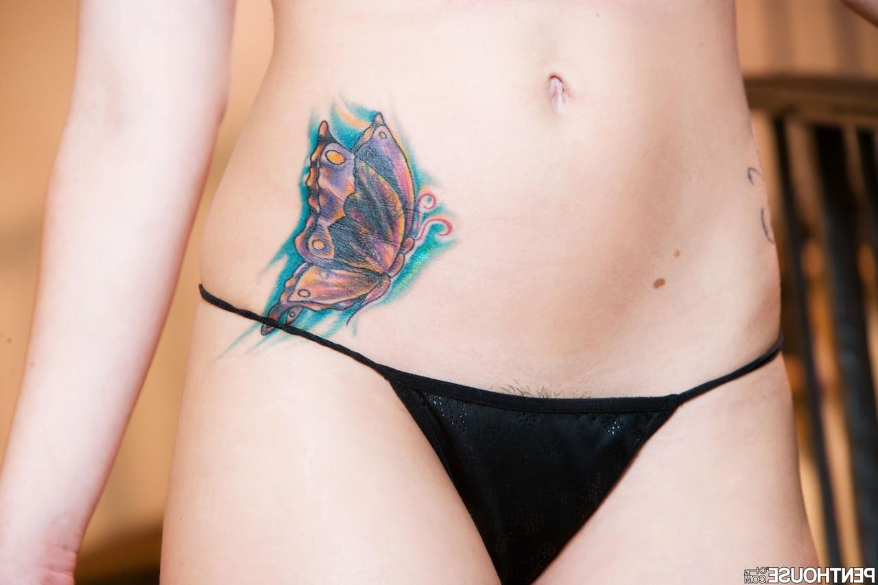 20P Short-haired babe Katie St. Ives strips on the stairs & shows her inked body