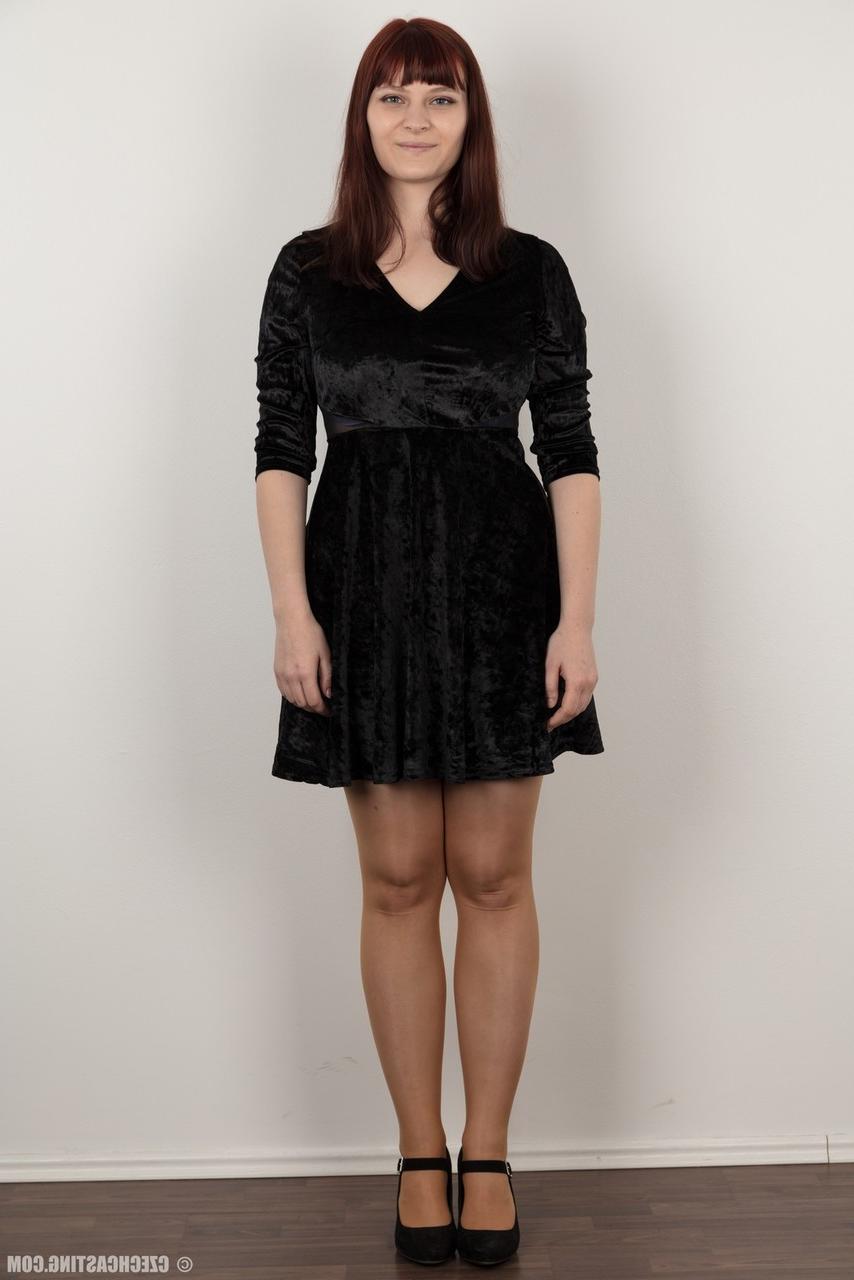 20P Tall redhead Eva removes a black velour dress prior to her first nude poses