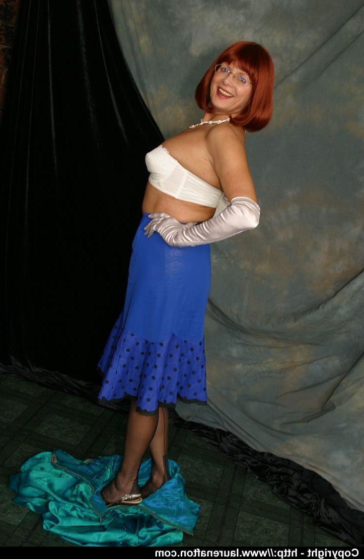 12P Older redhead Abigail Fraser uncovers her natural tits in opera gloves