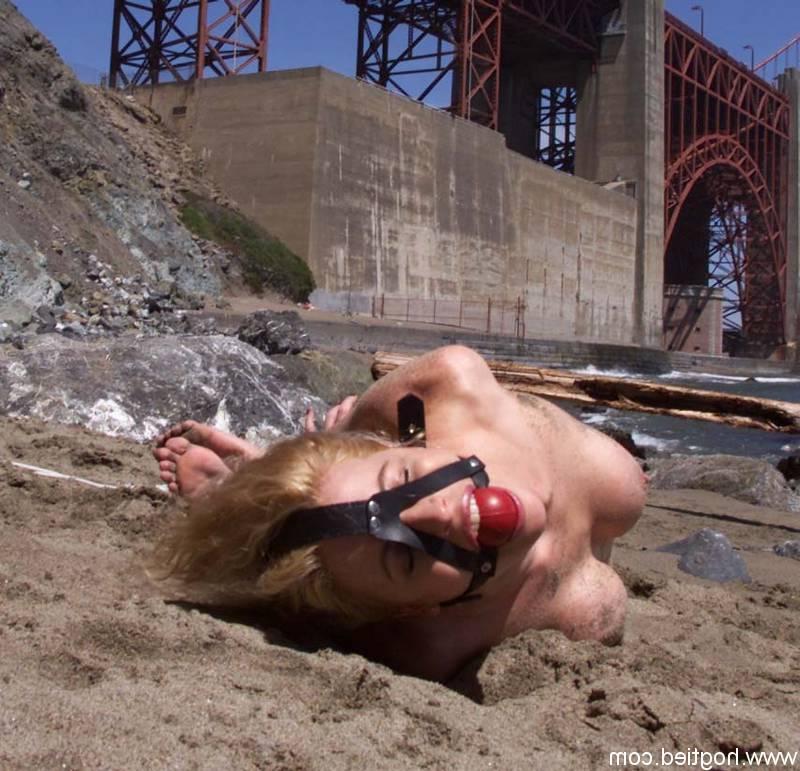 17P Blonde slave Sadie Belle getting bound and ball-gagged on the city beach