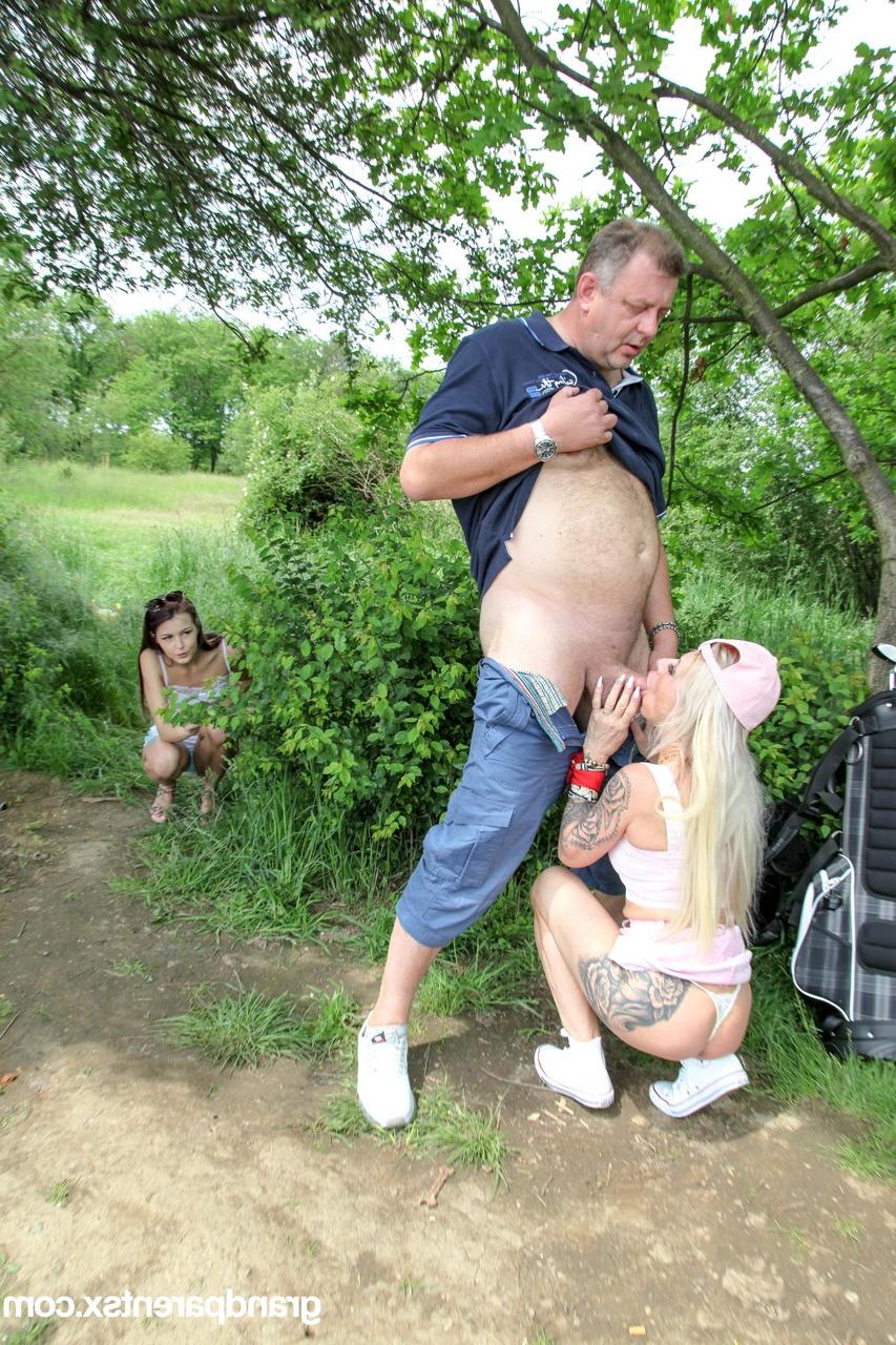20P Young nymphos Cindy Shine and Devil Red suck and fuck an old dick outdoors