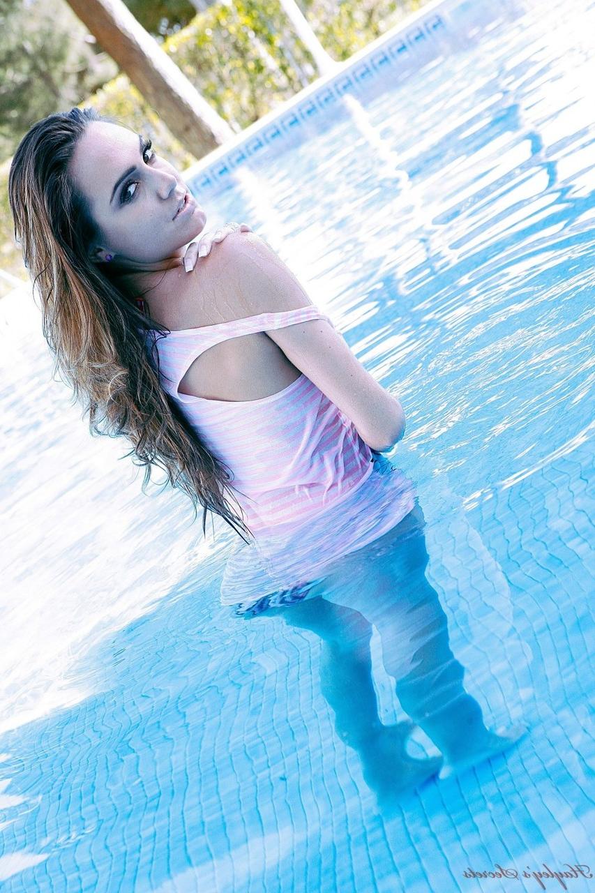 12P British amateur Jamie Jenkins goes topless in bikini bottoms at the pool