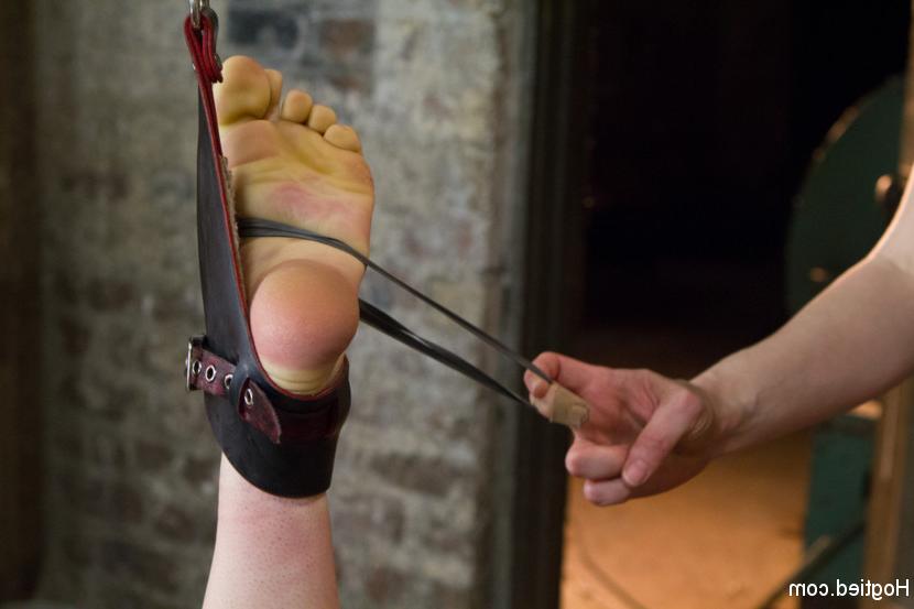 15P Submissive girl is restrained and penetrated by a couple of lesbians