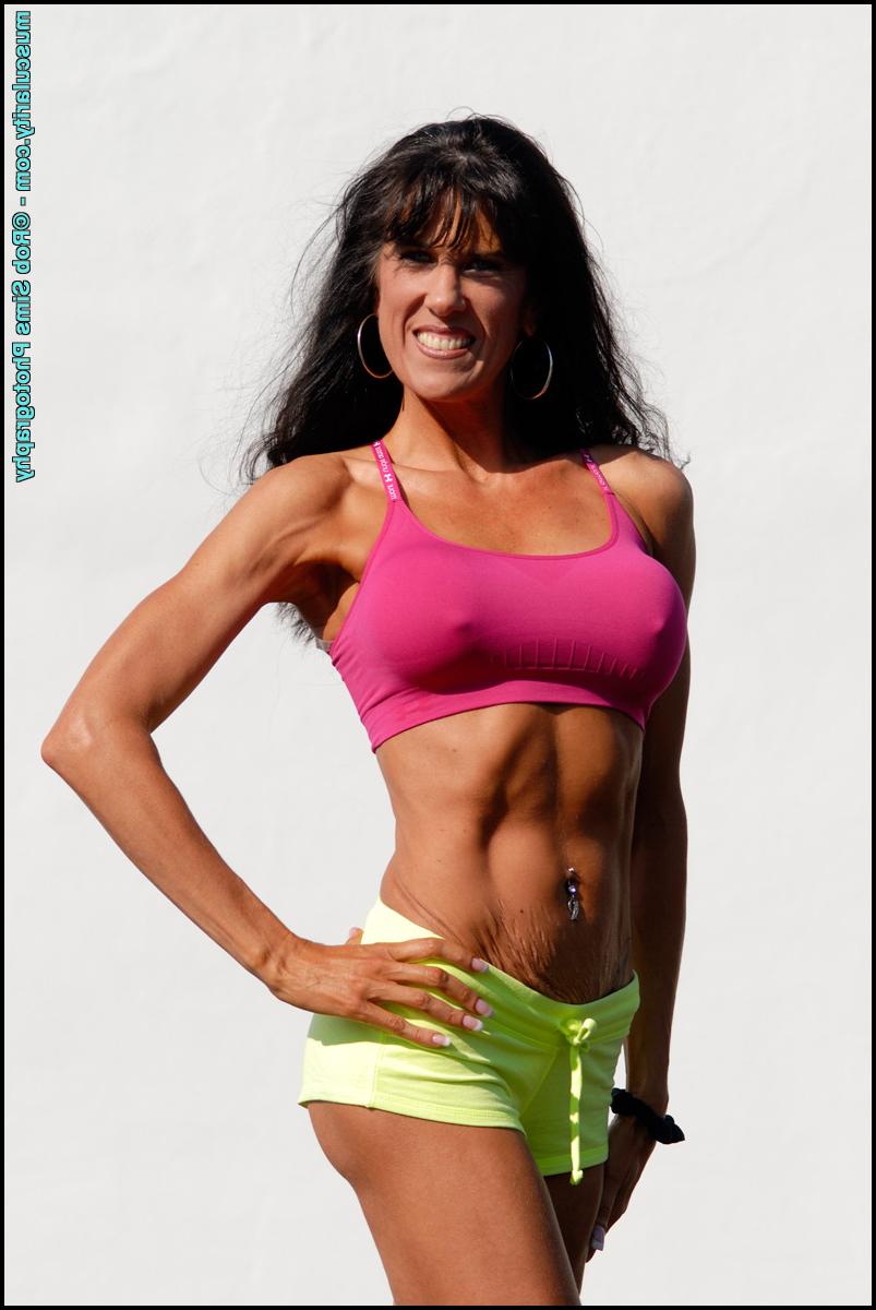 15P Bodybuilder Katie Carter takes off her bikini top in a teasing manner