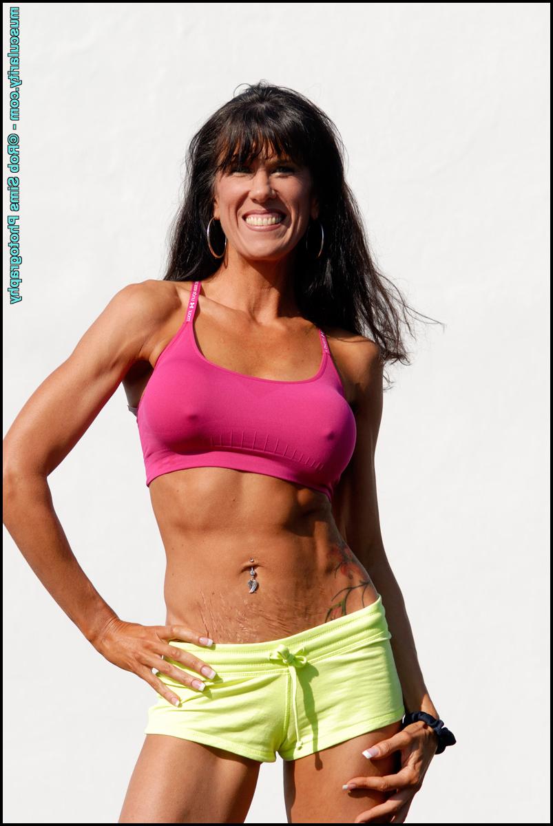15P Bodybuilder Katie Carter takes off her bikini top in a teasing manner