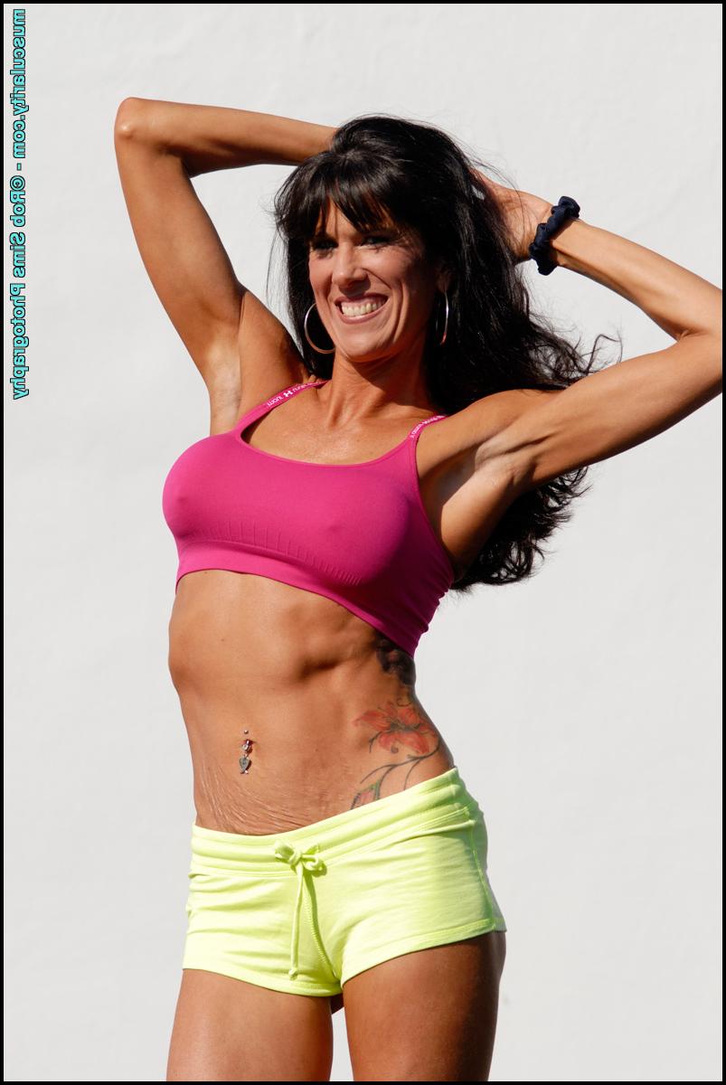 15P Bodybuilder Katie Carter takes off her bikini top in a teasing manner