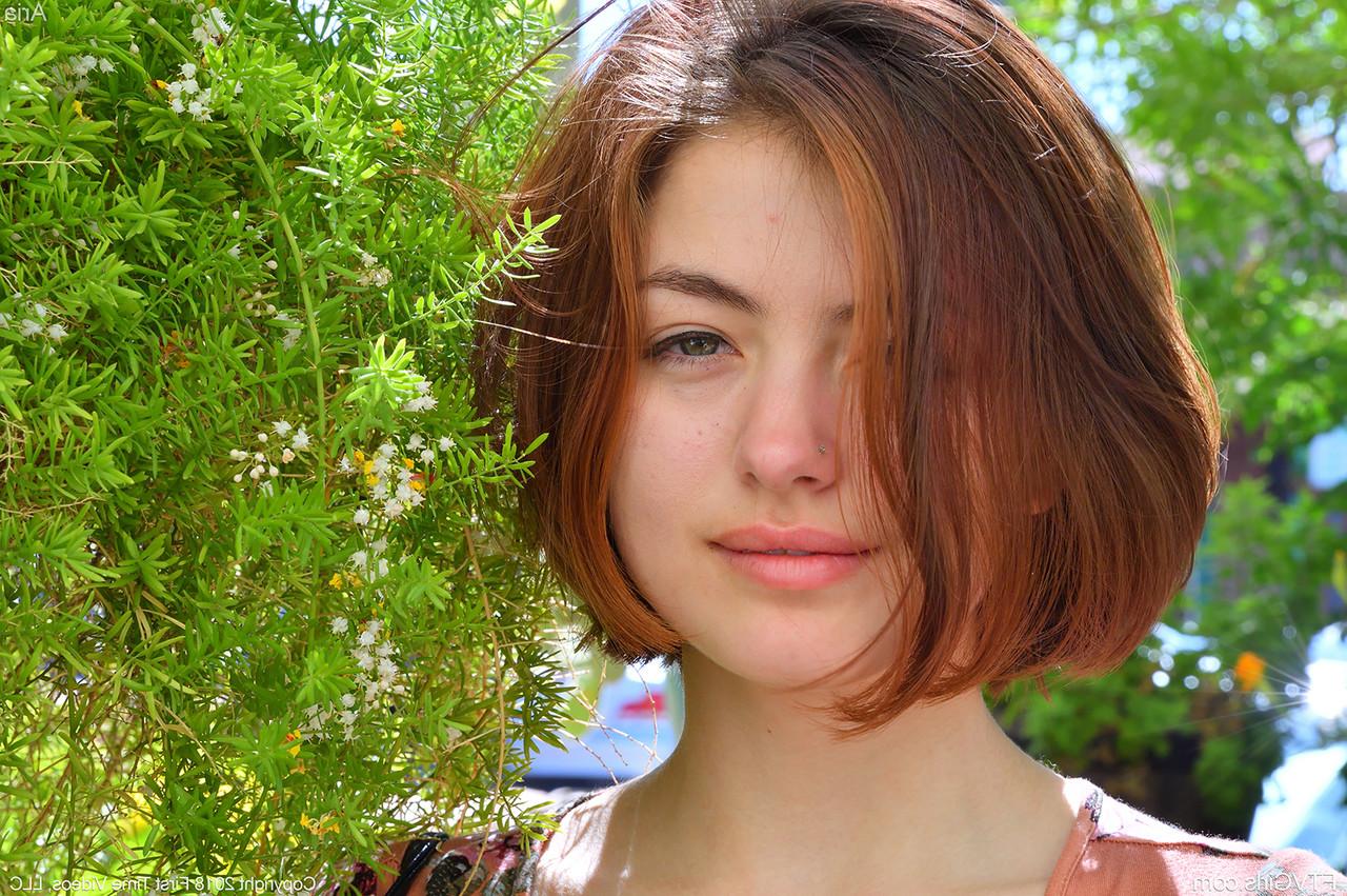 15P Pretty natural redhead Aria-II undressing outdoors to flaunt her nice big tits