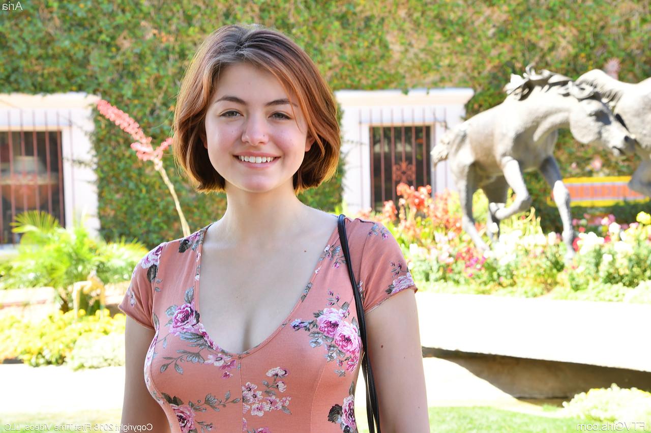 15P Pretty natural redhead Aria-II undressing outdoors to flaunt her nice big tits