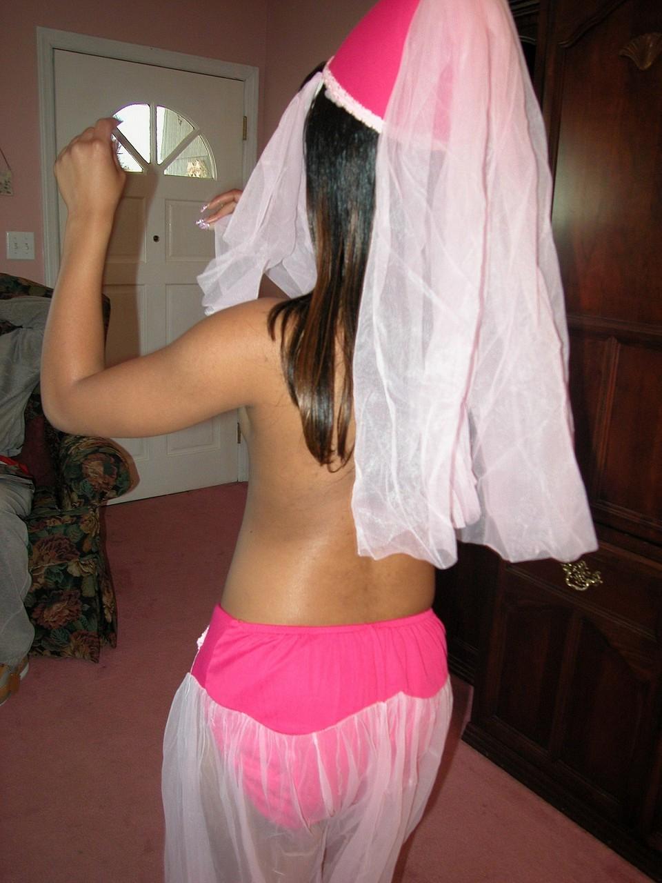 20P Sexy ebony belly dancer Isyss Lucero strips and shows her big black booty