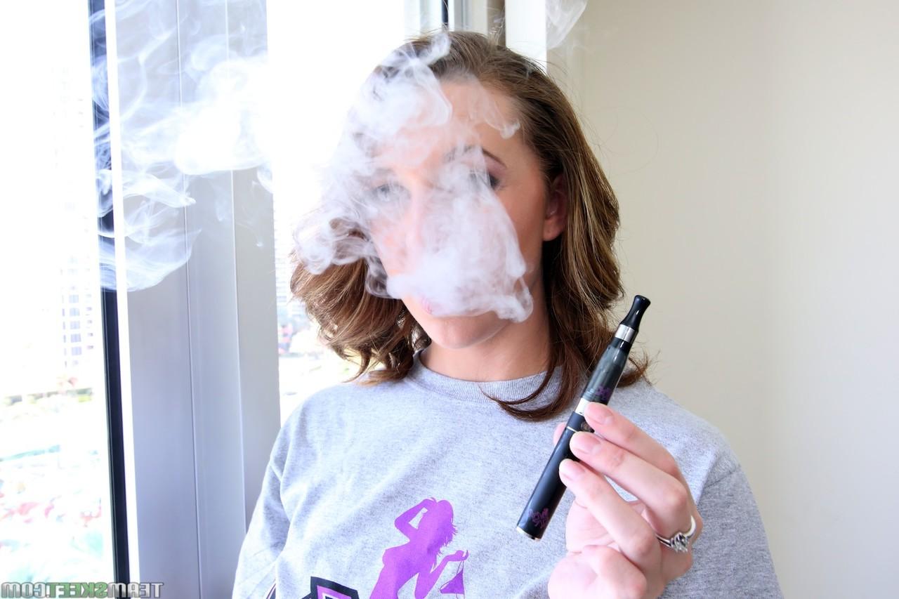 20P Busty Brooke Wylde plays with her amazing natural tits after smoking an e-cig