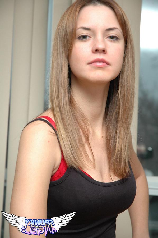 12P Pretty young Amy dressed in red sexy underwear bends over to show cleavage