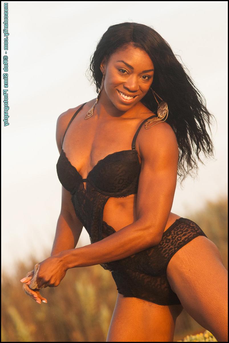 15P Ebony bodybuilder Arian Elizabeth models black swimwear in outdoor settings