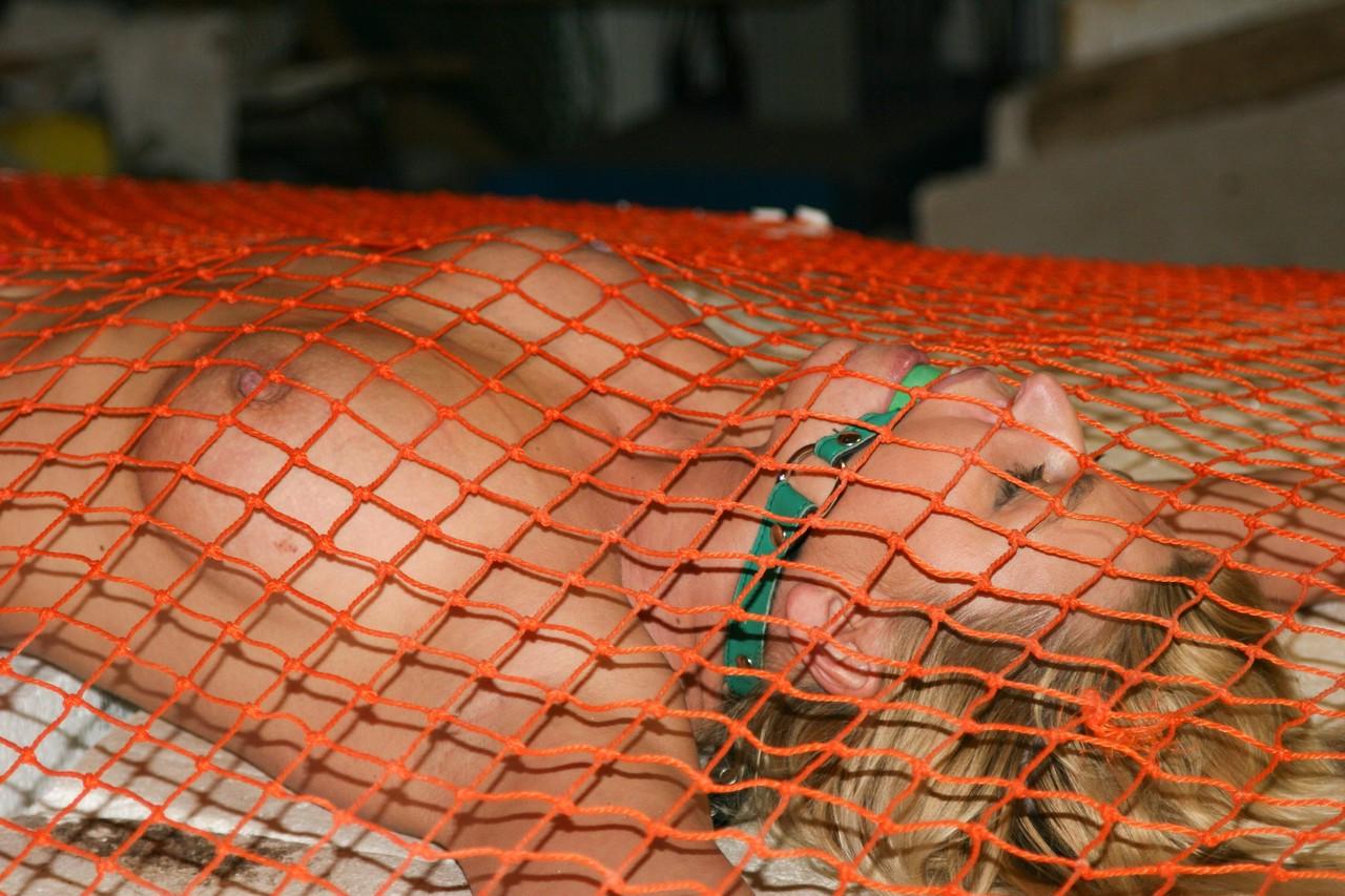 20P Bound and ballgagged blonde in fishnets Adrienne awaits for her punishment