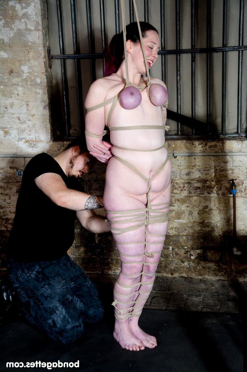 20P Busty brunette Alora Lux gets tied up in rope bondage while fully naked