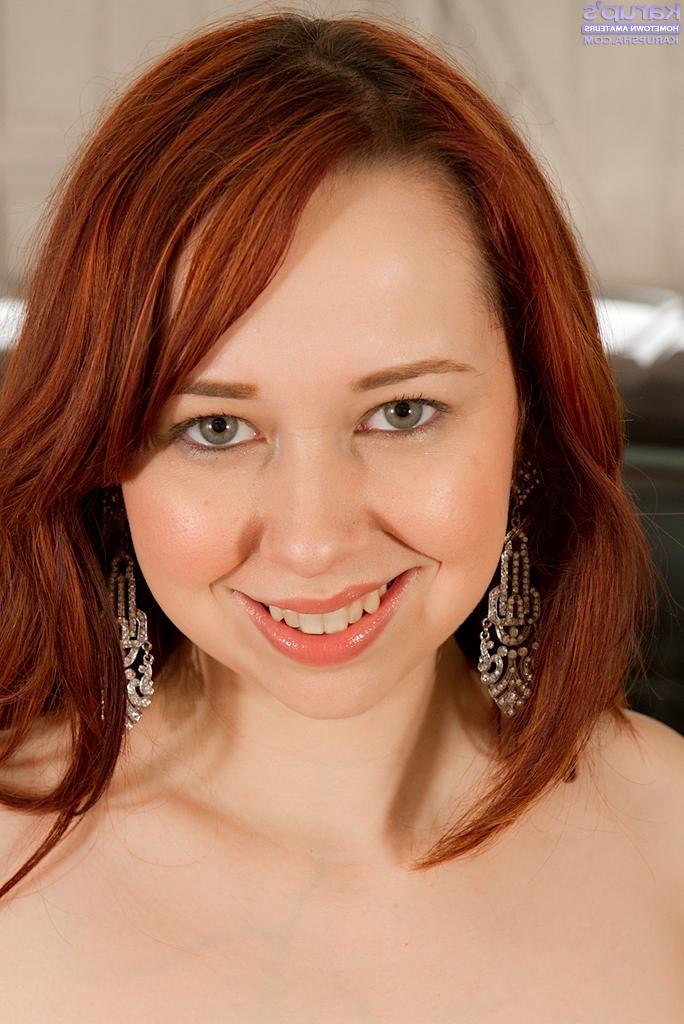 16P Bosomy redhead chick with ample booty slowly getting rid of her clothes