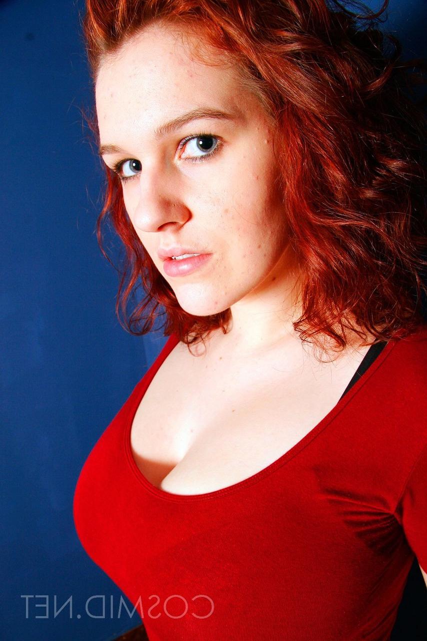 16P Chubby redhead Eva sets her big natural tits free of a brassiere