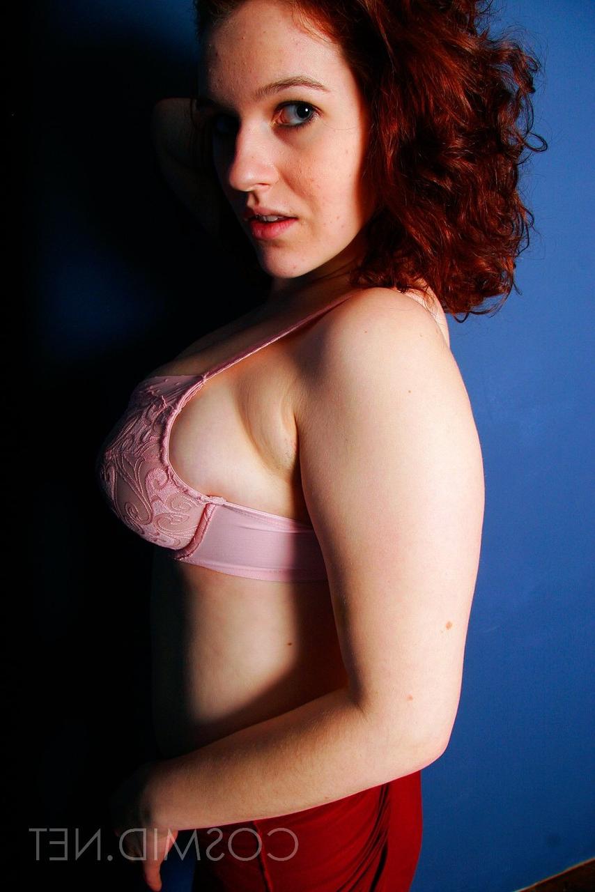 16P Chubby redhead Eva sets her big natural tits free of a brassiere