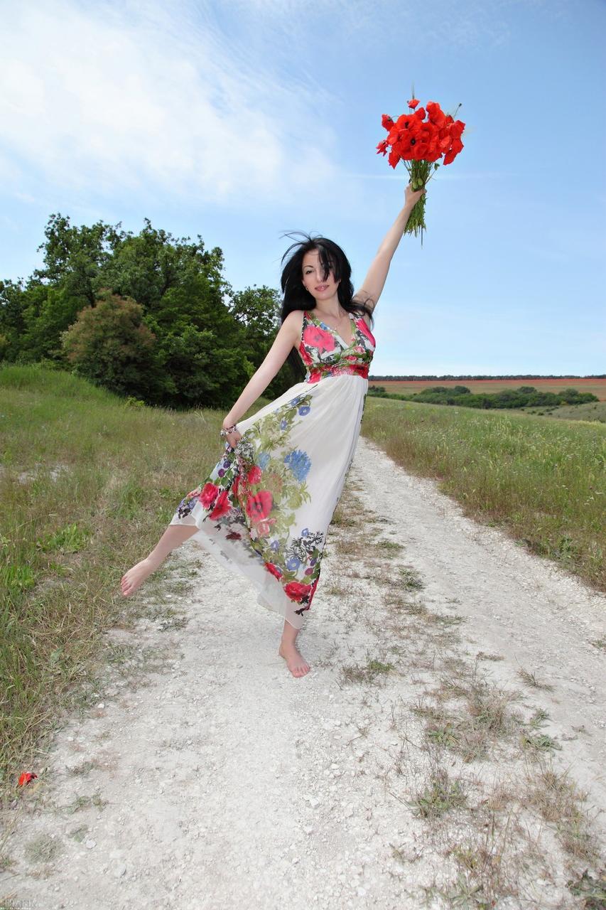 20P Glamorous babe Melani A strips in beautiful nature and poses naked
