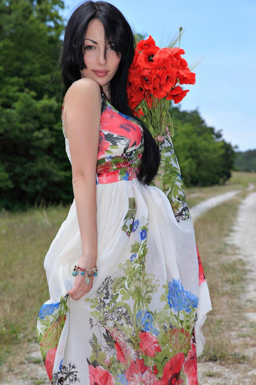 20P Glamorous babe Melani A strips in beautiful nature and poses naked