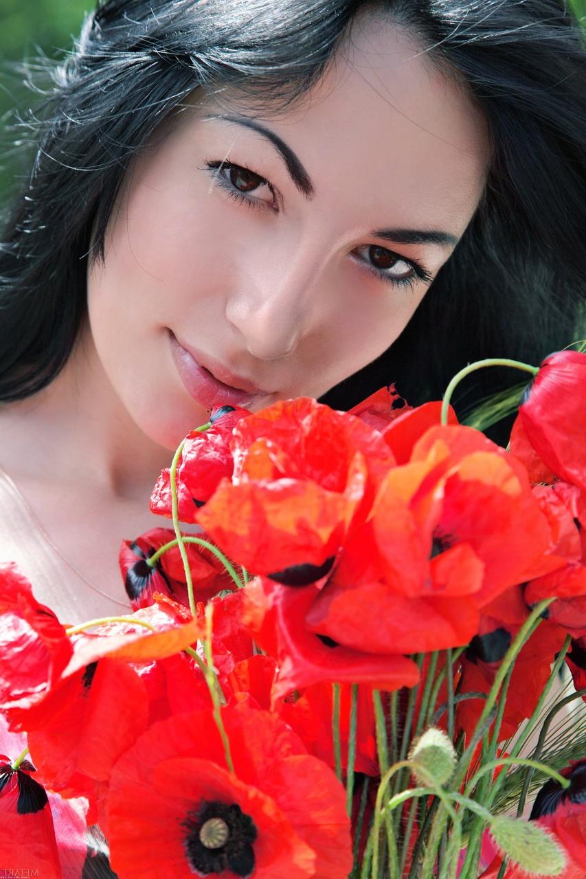 20P Glamorous babe Melani A strips in beautiful nature and poses naked