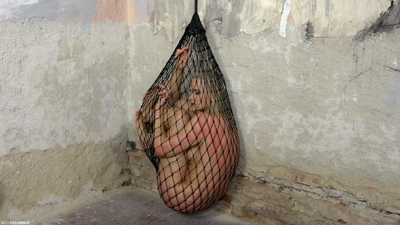 20P Struggling captive nude Katy Sky gets toyed while trying to escape a net