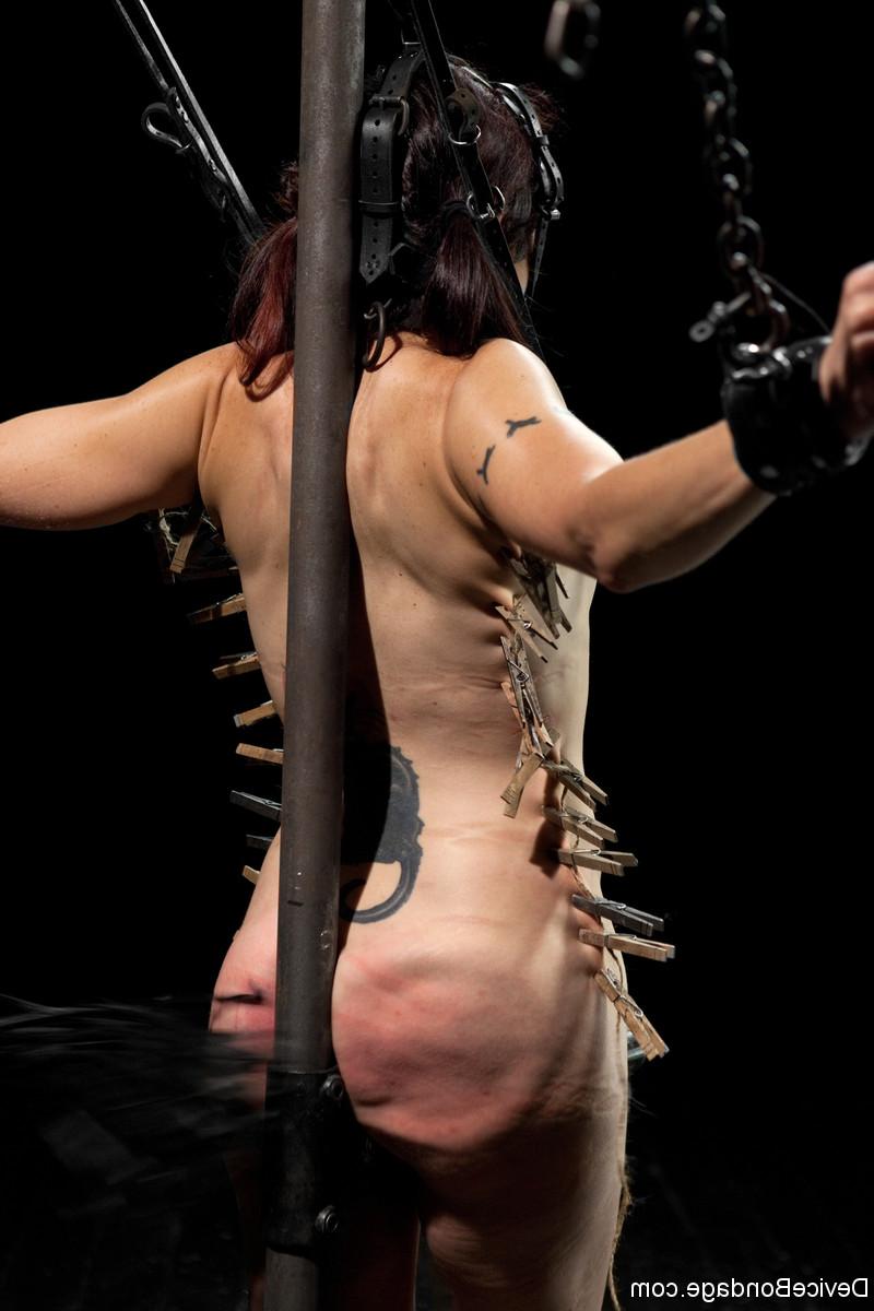 20P Naked redhead Annika endures a painful BDSM session in metal bondage