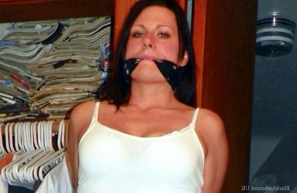 13P Brunette chick is blindfolded and gagged while her arms & legs are restrained