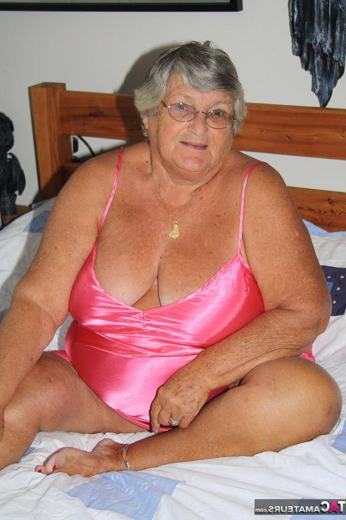 20P Fat old woman Grandma Libby frees her tan lined body from satin lingerie