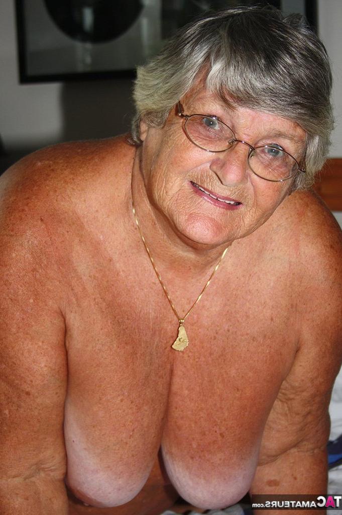 20P Fat old woman Grandma Libby frees her tan lined body from satin lingerie