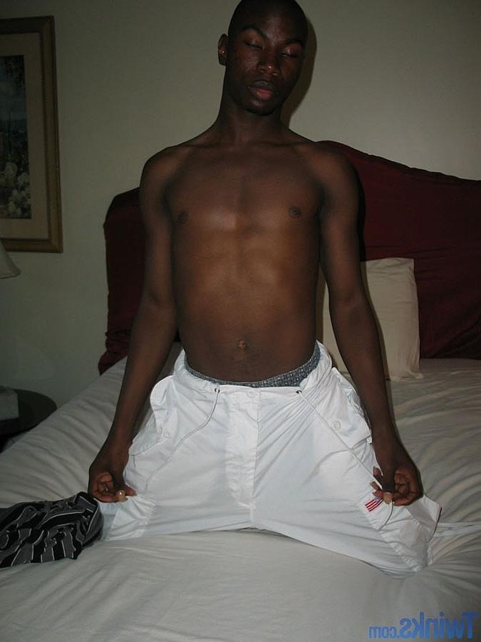 20P Ebony twink strips naked and jerks his shaved cock until he ejaculates