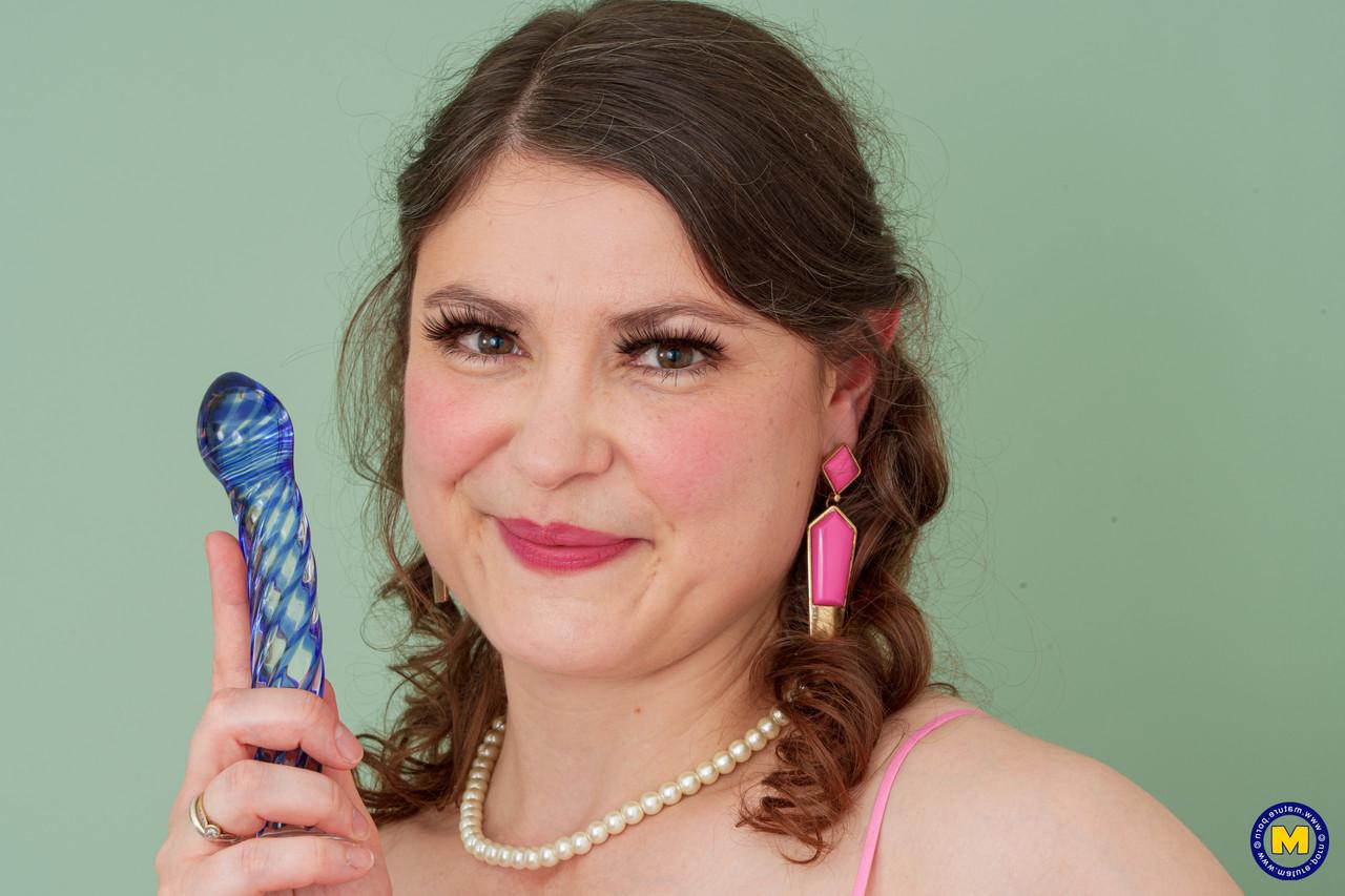 11P Mature plumper Aurora Frost masturbates with a sex toy while wearing stockings