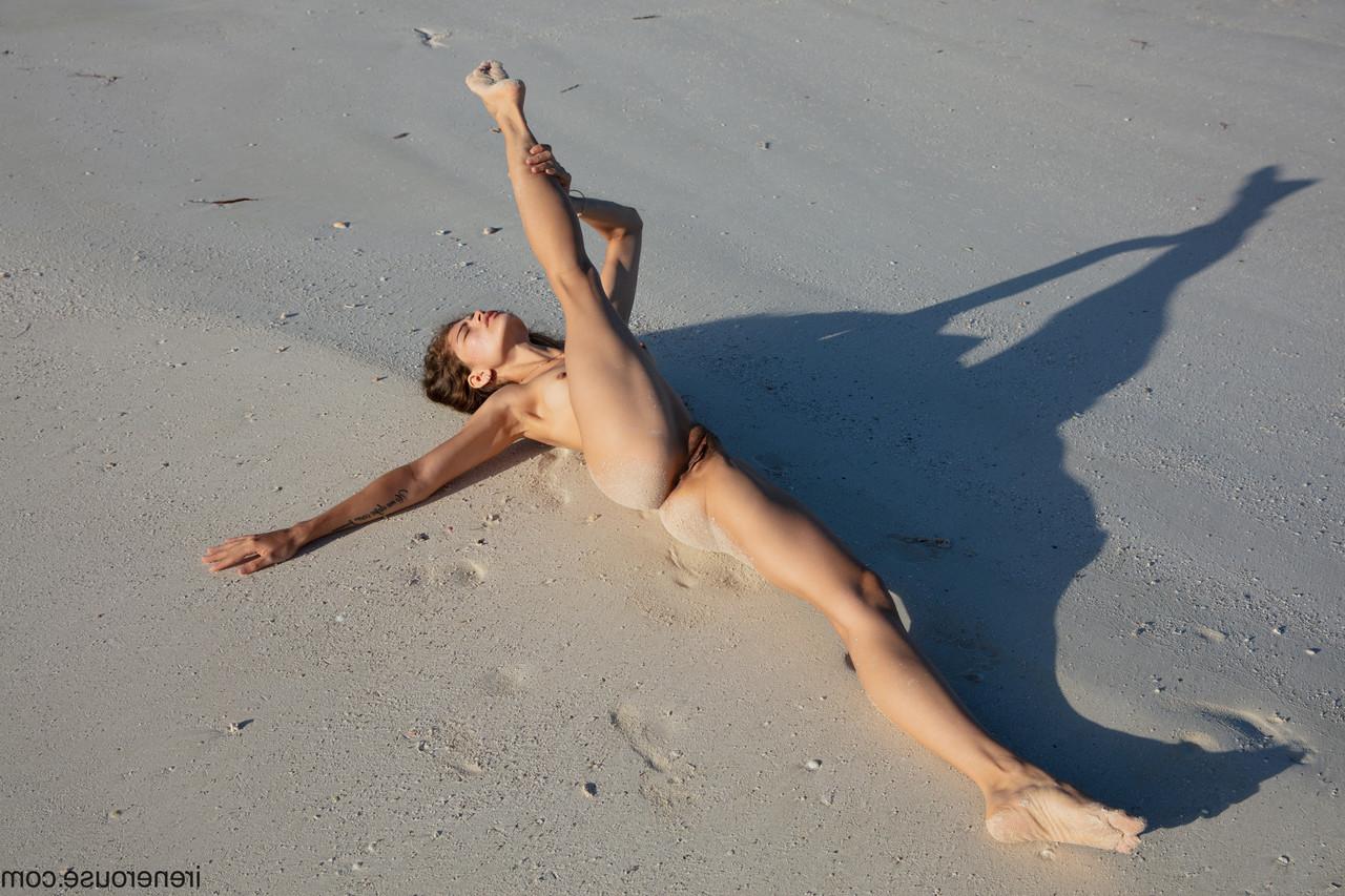 15P Flexible Colombian teen Irene Rouse posing butt naked on a sandy beach