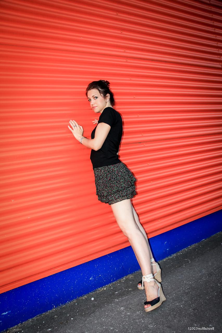 20P Raven-haired hottie flashes her black panties while posing in public