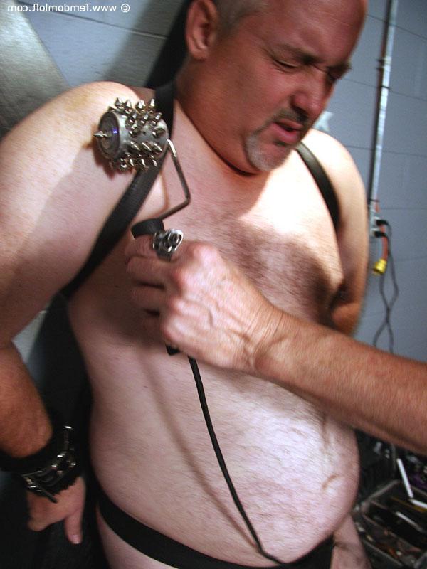 16P Mature lady dominates a submissive man up against a St Andrews Cross