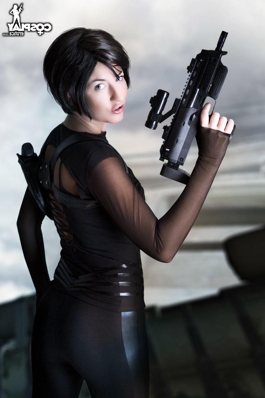 12P Dark haired cosplayer sucks on the barrel of her rifle before showing her tits